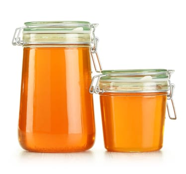 Jars of honey isolated on white
