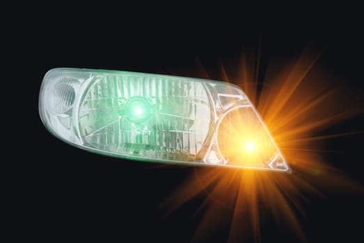 automotive head lamp on black background