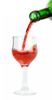pour red wine into glass isolated on white