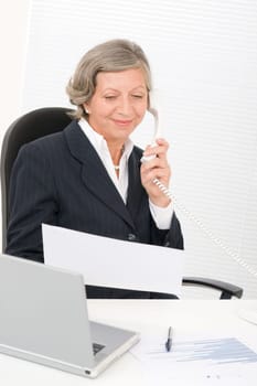 Senior professional businesswoman on phone hold empty sheet smiling