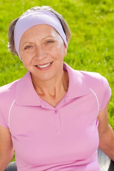 Senior sportive woman smiling outside portrait sunny day
