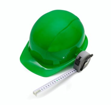 Green Safety helmet and measuring tape isolated on white