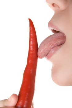 girl close up licking chili pepper isolated on white