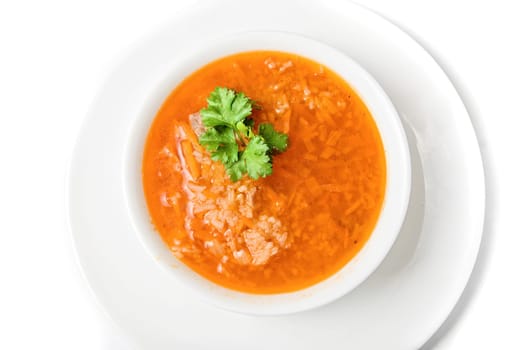 Bowl of vegetable borscht soup isolated on white