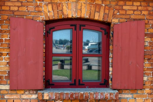 Vintage Wooden window on red brick wall