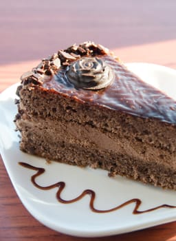 piece of chocolate cake at white plate