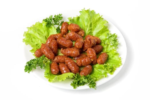 grilled sausages on green lettuce with isolated on white