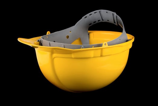 Yellow helmet isolated on a black background