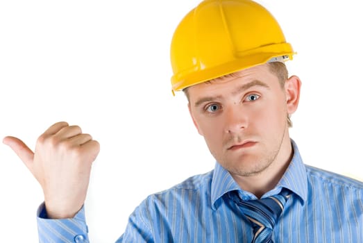 Young man at yellow helmet and hand sign isolated on white