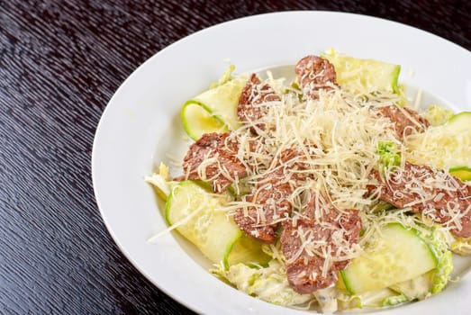 Salad with beef, lettuce, cucumber, string beans, Chinese cabbage and sauce