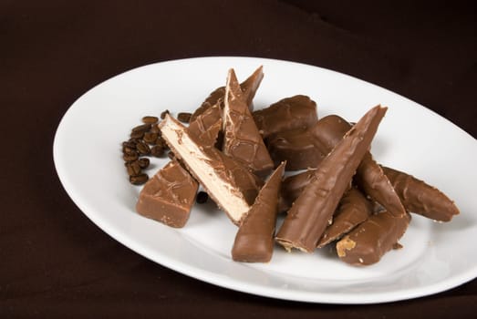 chocolate plate on the dark brown background