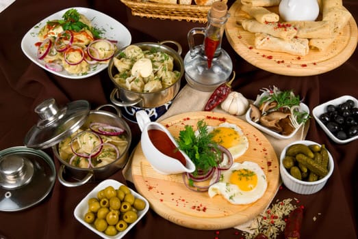 Many food dishes on the restaurant table. close up.