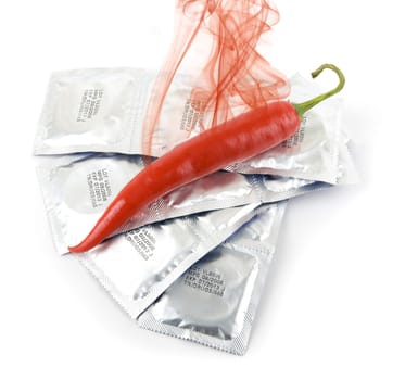 Red peppers on a condom packs over white background