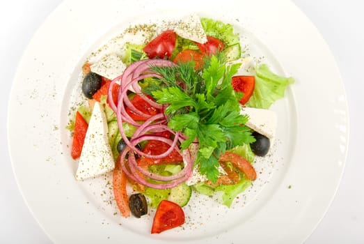 Caesar salad dish close up on a white background
