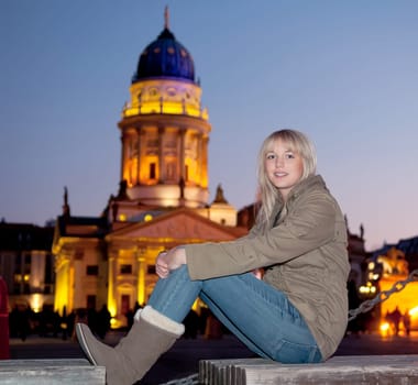 Young woman in the city in the evening