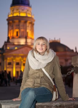 Young woman in the city in the evening
