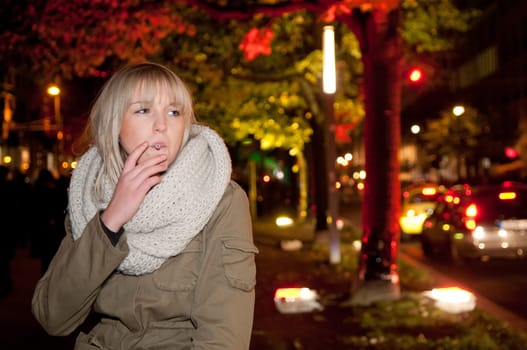 Young woman smoking a cigarette