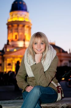 Young woman in the city in the evening