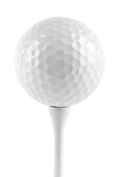Golf ball on tee against white background