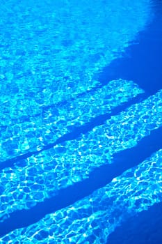 Close-up of beautiful blue water ripples in a swimming pool