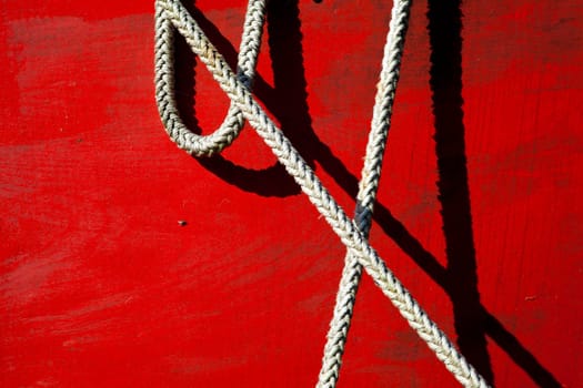 Ship part in red with rope