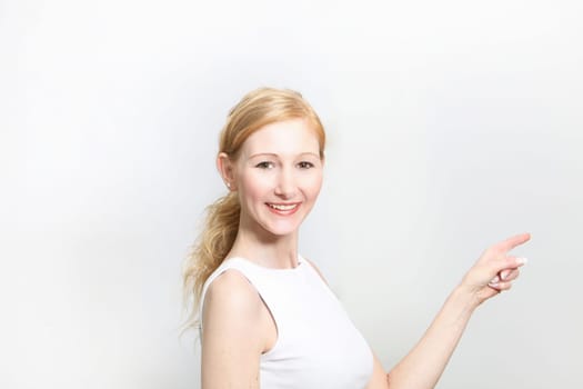 Boy  Pretty woman pointing at some copy space - horizontal