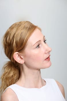 Young woman looking to the right - vertically