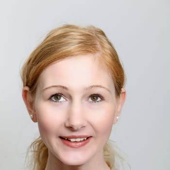 Cheerful young woman looking up - square