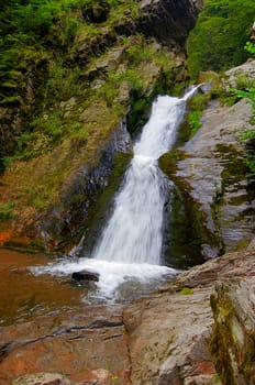 Shot of the fall of water. Stream Huntava - natural area - nature preserve. Resov, Czech republic, Europe.