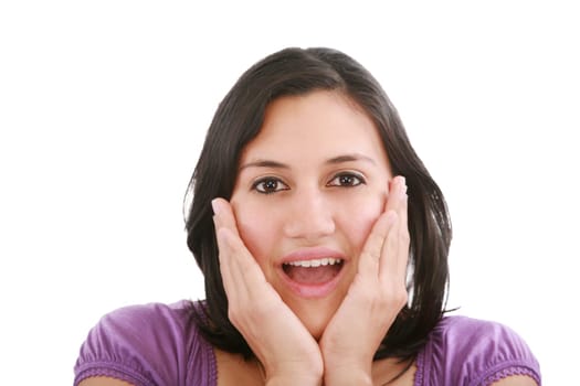Portrait of young surprised girl holding her face