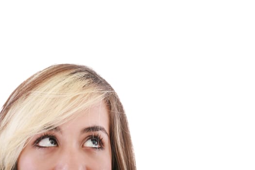 Close-up portrait of a beautiful teenager. Looking up into the corner. Lots of copyspace and room for text on this isolate.