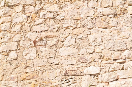 Detail of a stone wall with different size of rock.