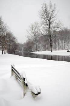 A local park fully covered with snofall in winer