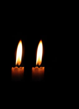 Glowing candle symbol of peace and happiness