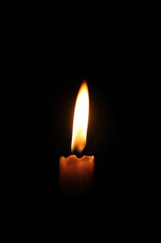 Glowing candle symbol of peace and happiness