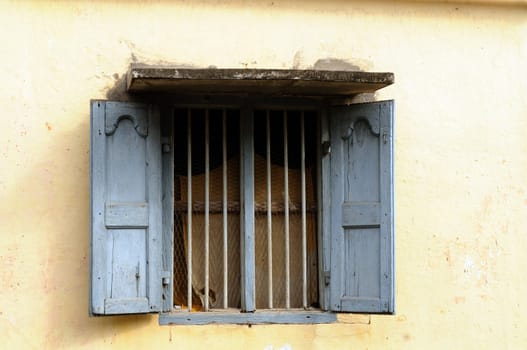 An old window on an overcast tropical summer