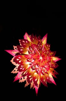 A colorful christmas star lit up