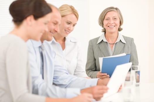 Business team attractive businesswomen with happy colleagues working around table