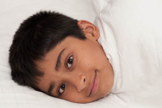 A handsome indian kid smiling for you