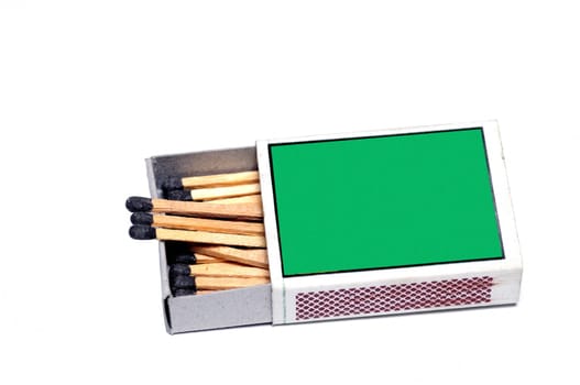 A green matchbox isolated on a white background