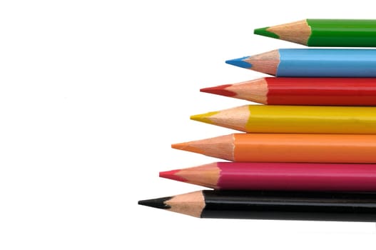 Colored pencils isolated on black back ground