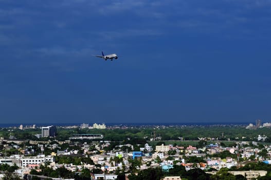 A modern Asian city very densly populated and close to airport
