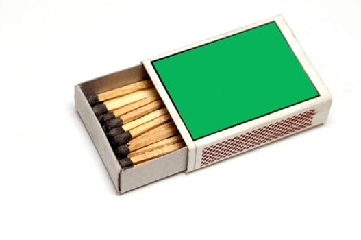 A green matchbox isolated on a white background
