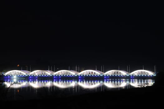 colorfully and beautifully lit bridge during the night