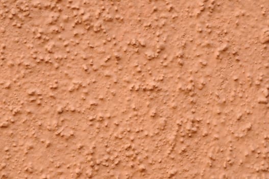 Textures revealed in a concrete wall by afternboon sunlight