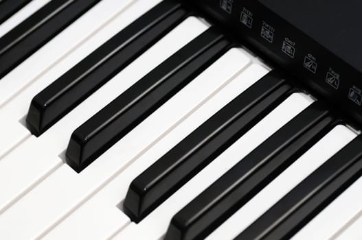 Close up photo of a black and white piano keys