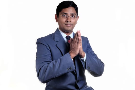 An handsome Indian businessman smiling with success