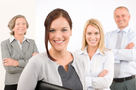 Business team attractive young businesswoman with happy mature colleagues