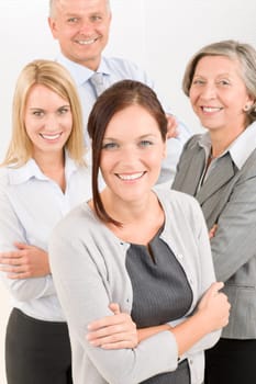 Business team attractive young businesswoman with happy mature colleagues