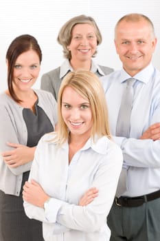 Business team attractive young businesswoman with happy mature colleagues